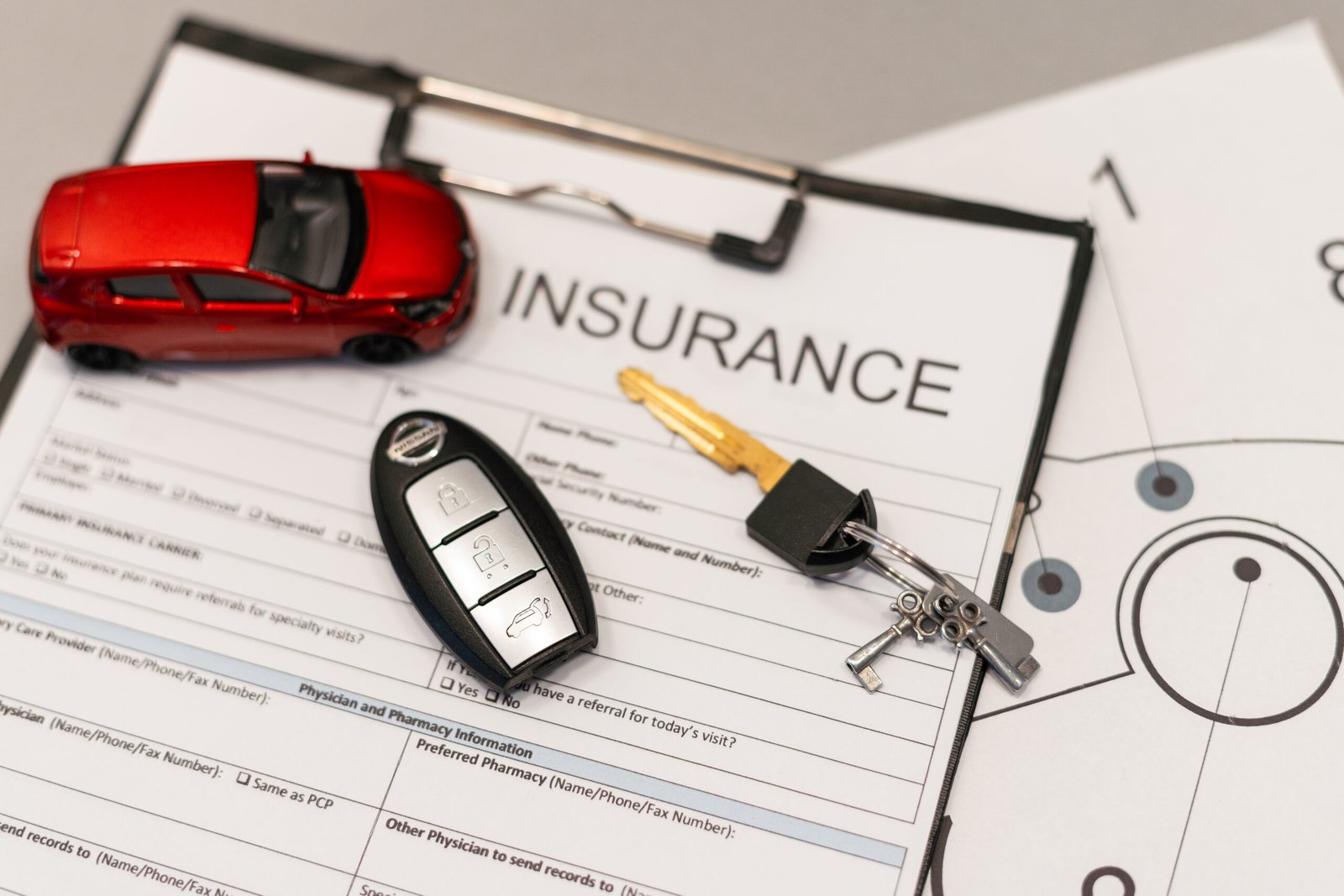 Car insurance form with car key. High quality photo